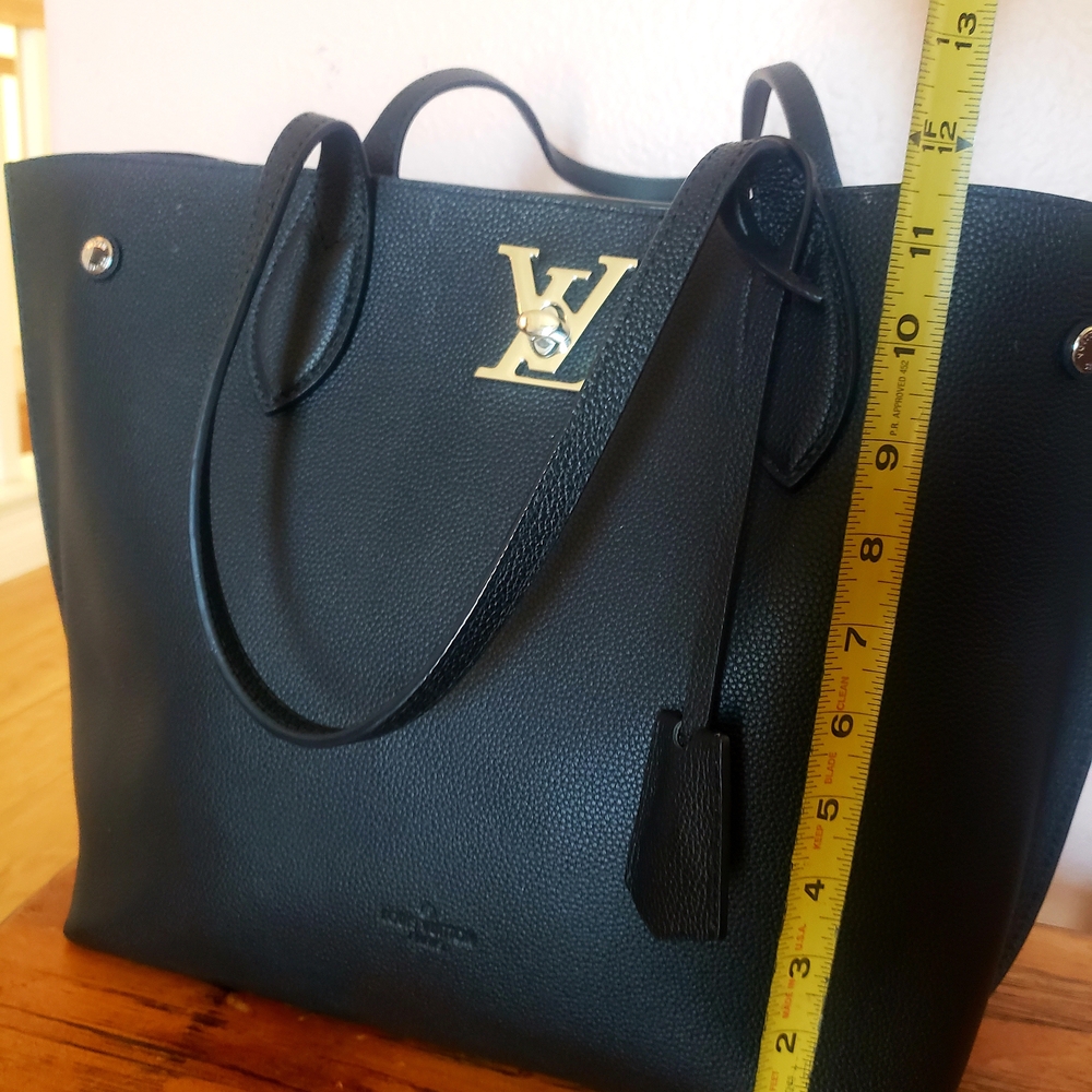 Black Leather Bag  With silver Logo.